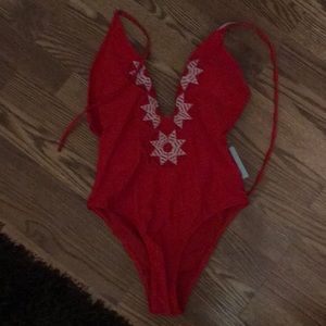 Red one-piece swim suit